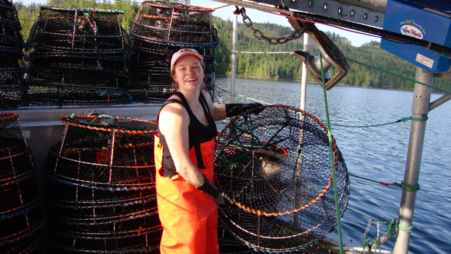 Prawn fisherman checks her gear on the North Island. Prawn fisherman