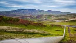 photo of pipeline laid across vast mountainous area. Photo credit Mike Benna